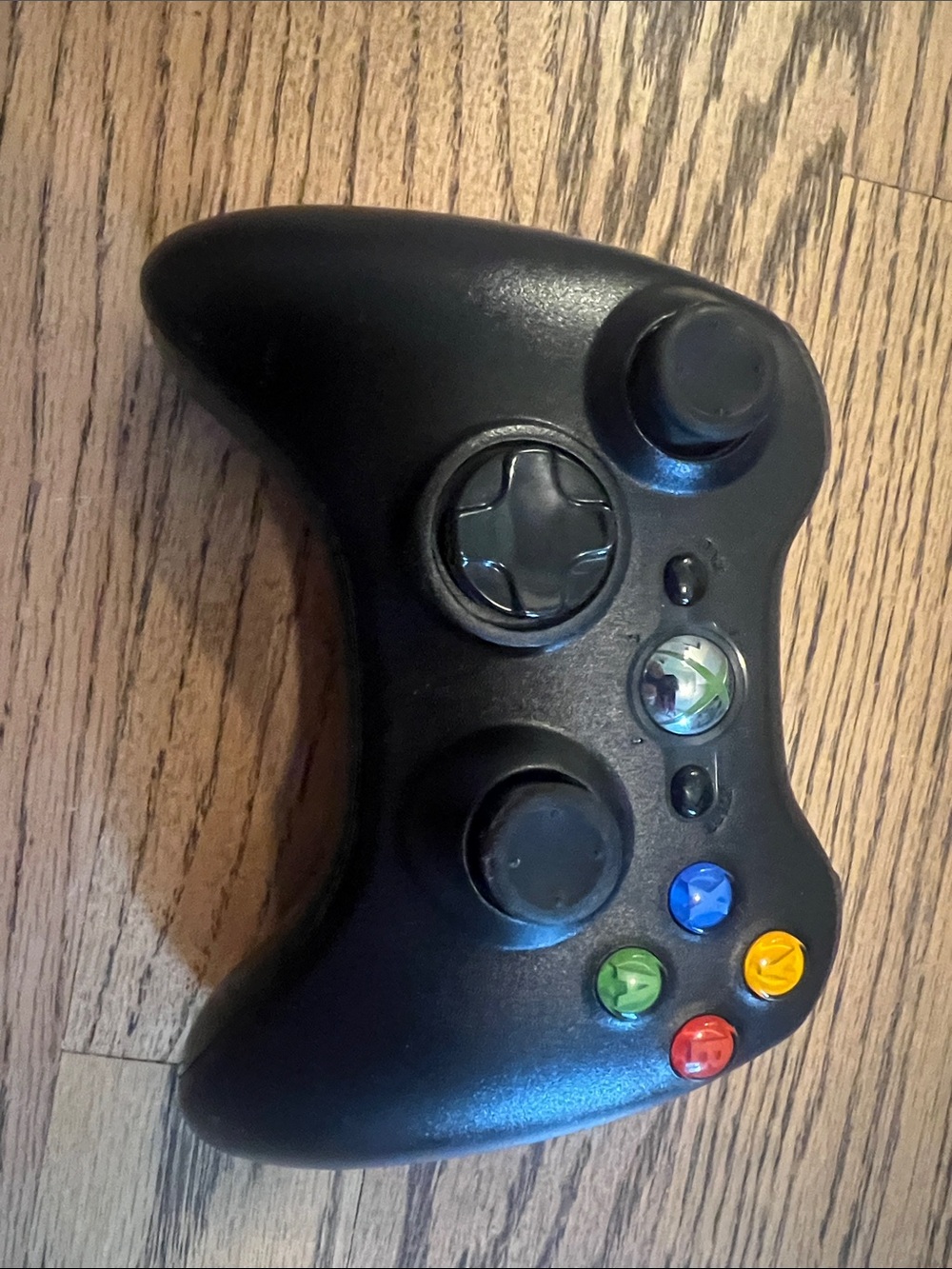 Black Wireless Game Controller with Colored Action Buttons